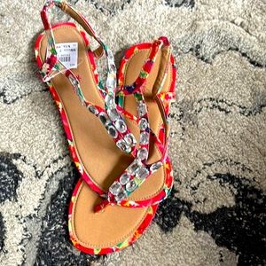 Never worn still has tags on them. Pink beads sandals size 7